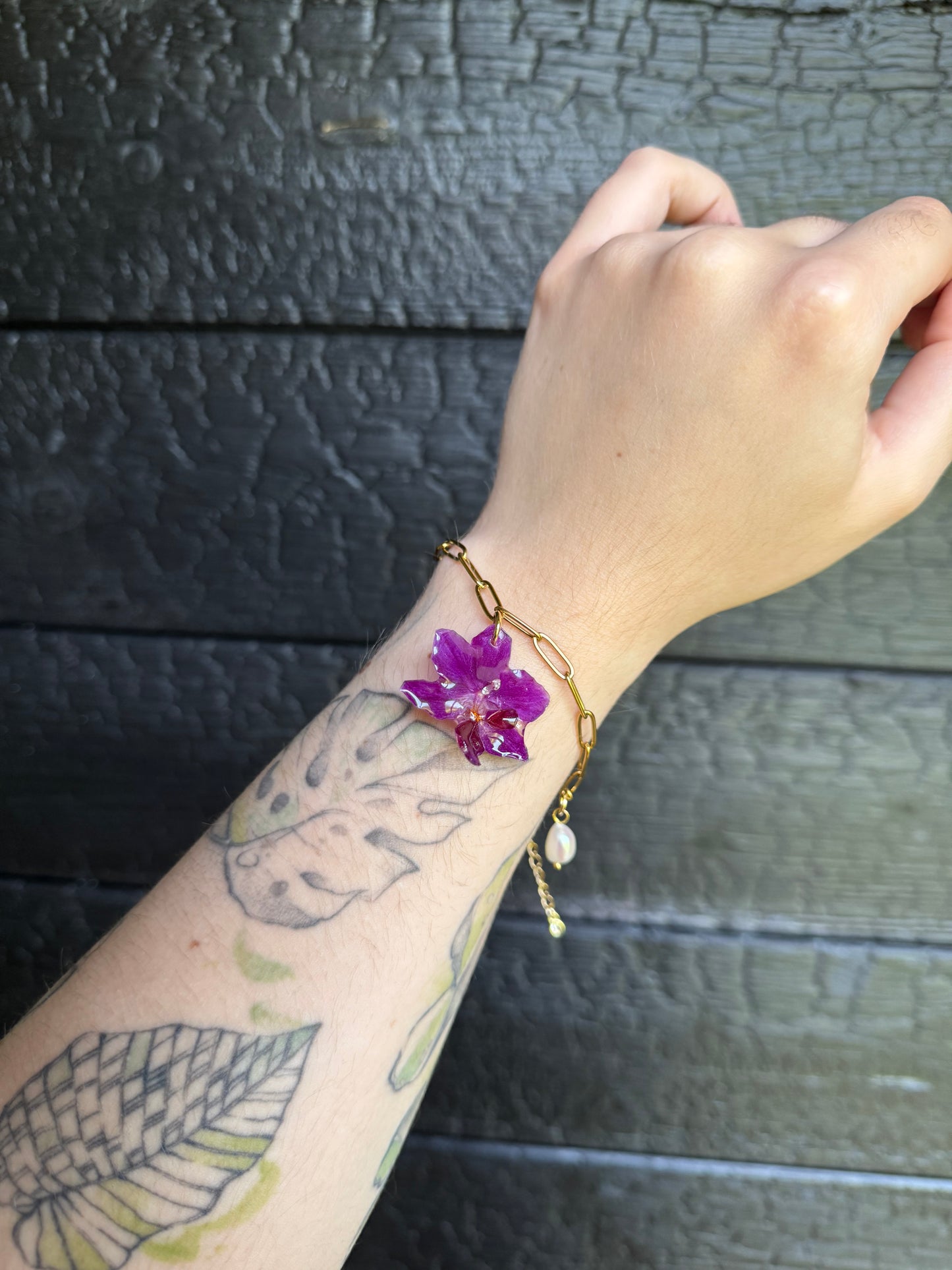 Orchid and pearl shell charm bracelet
