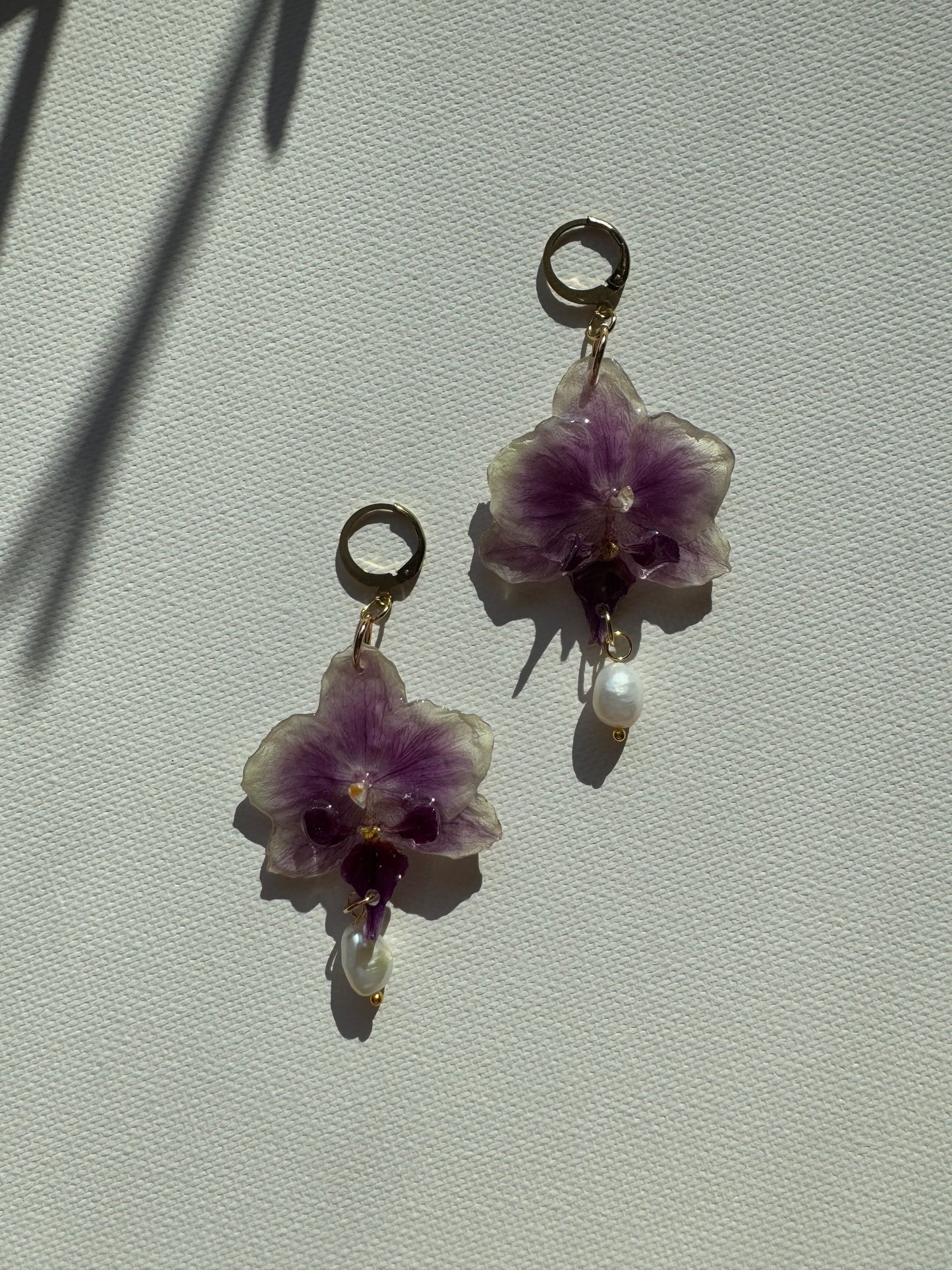 Orchid earrings with pearl charms