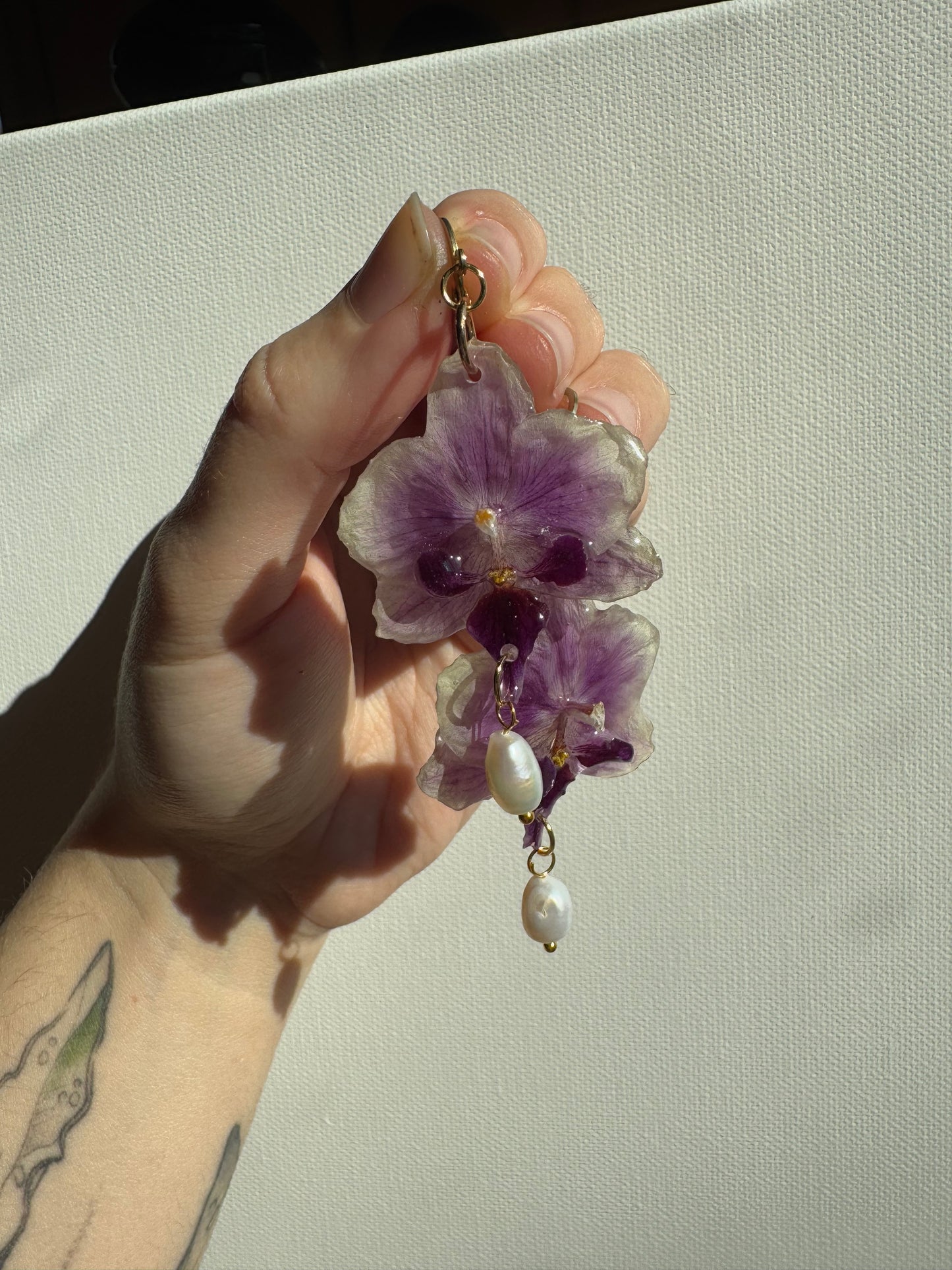 Orchid earrings with pearl charms