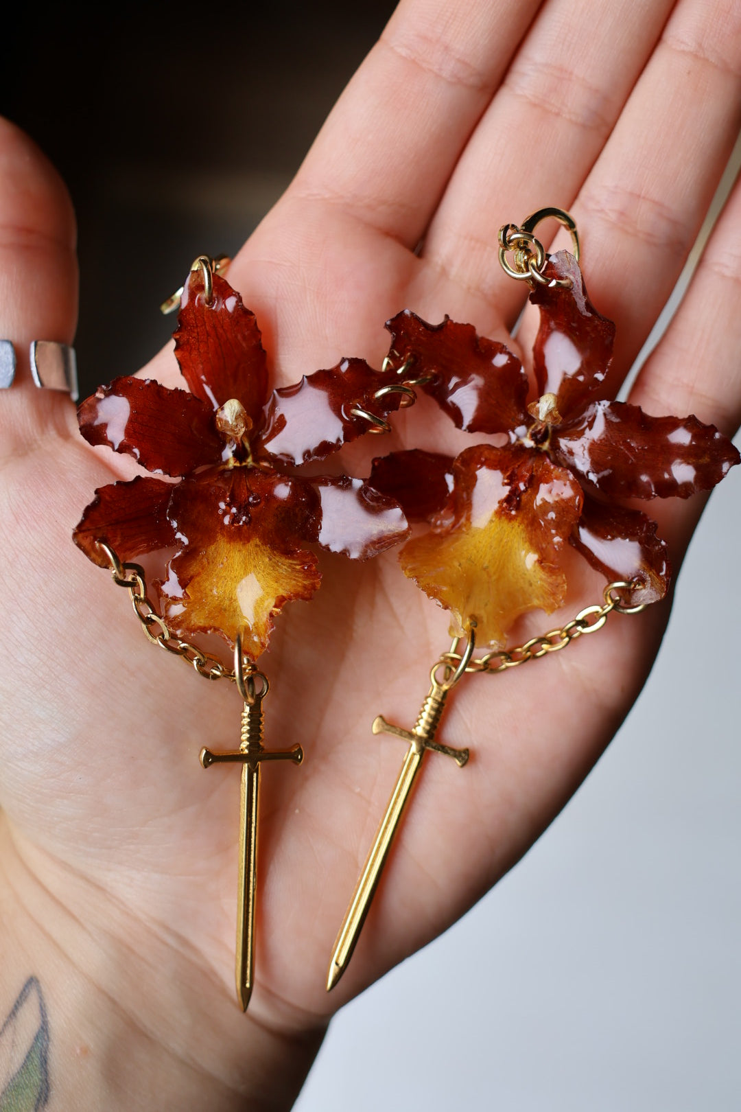 Red orchid and swords earrings