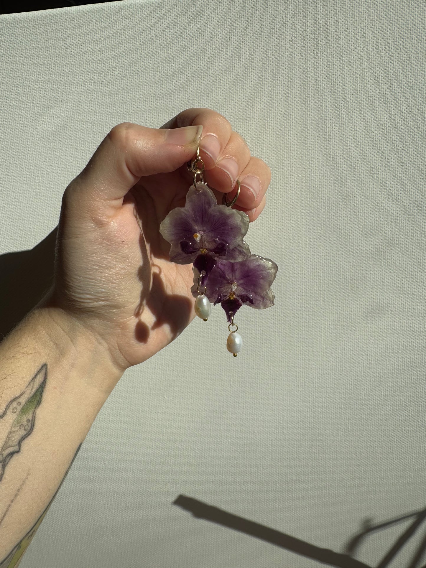 Orchid earrings with pearl charms