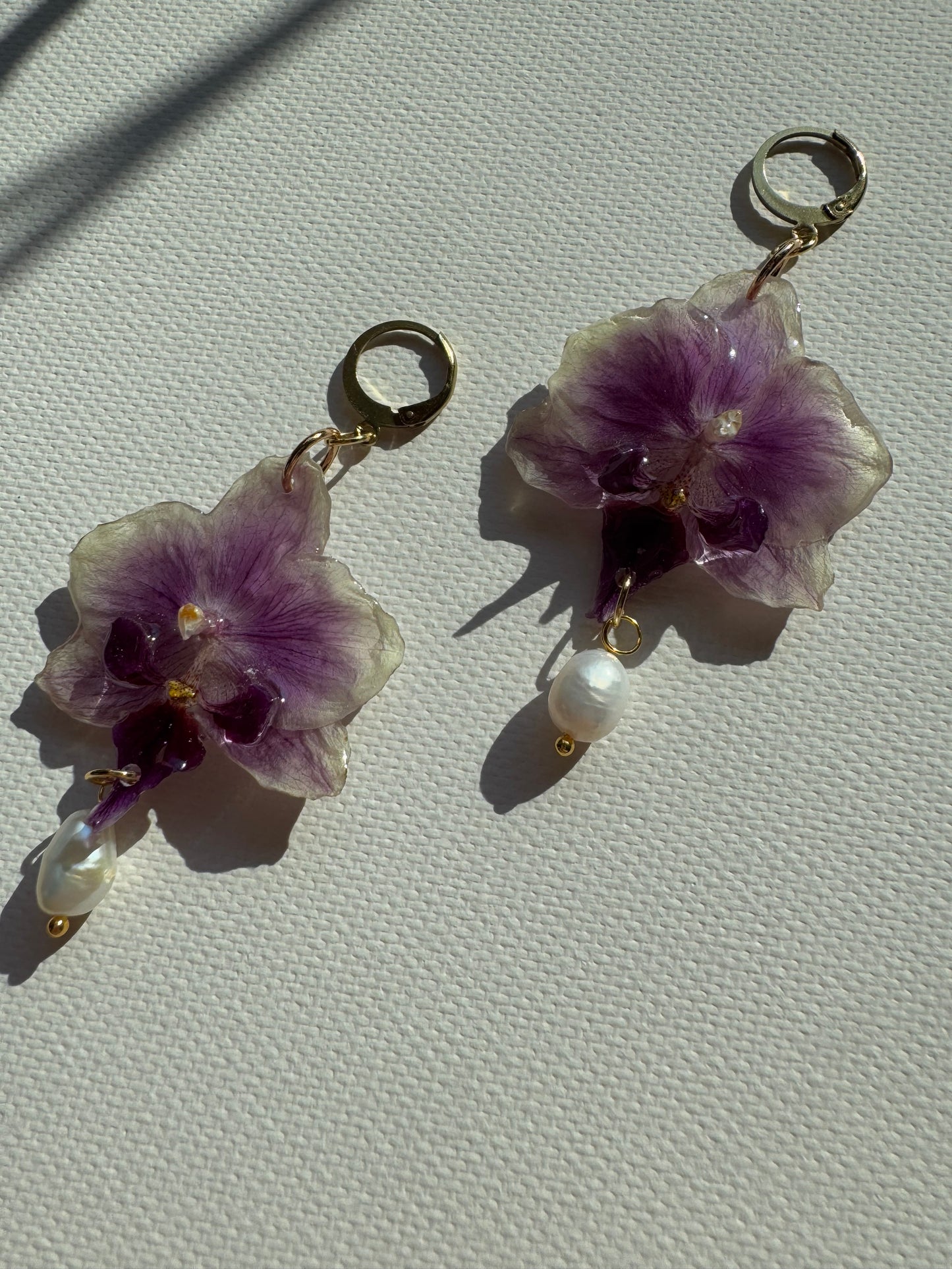 Orchid earrings with pearl charms