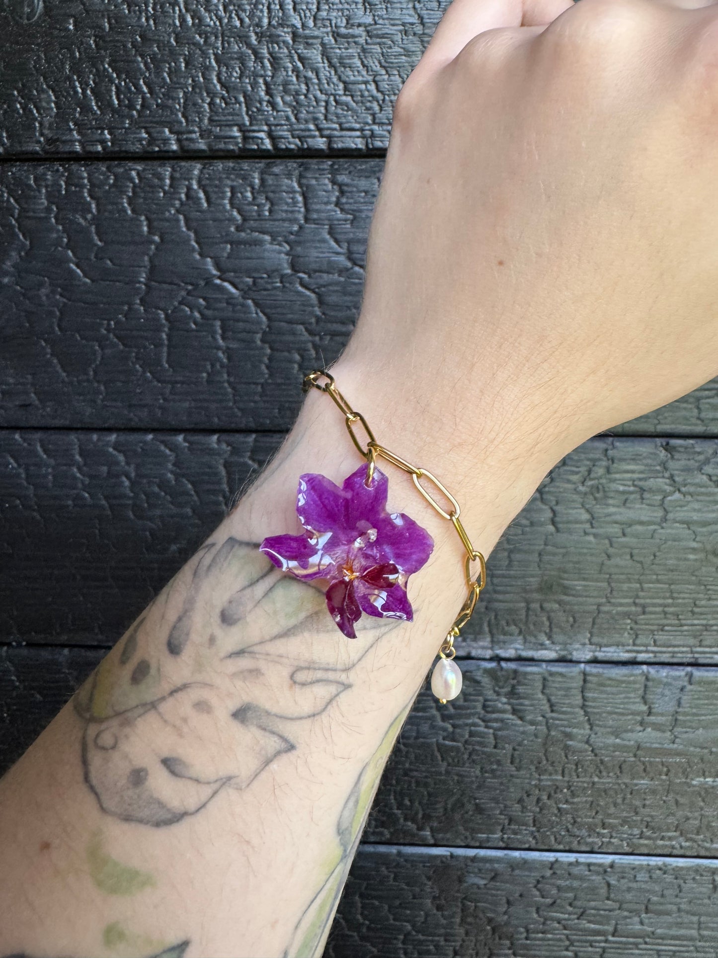 Orchid and pearl shell charm bracelet